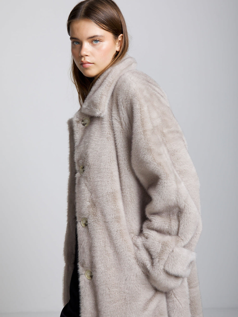 Cozy beige faux fur coat with a belted waist and oversized fit, perfect for stylish warmth this season. MEOTINE brand.