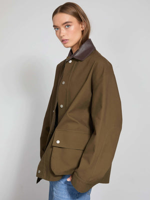A model showcases a stylish brown collar jacket with a relaxed fit, perfect for a casual look by MEOTINE.