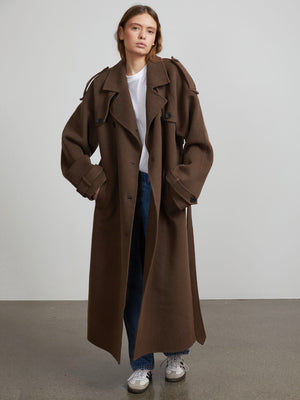 Oversized brown trench coat with a relaxed fit, styled with a white tee and jeans, showcasing MEOTINE's unique design.
