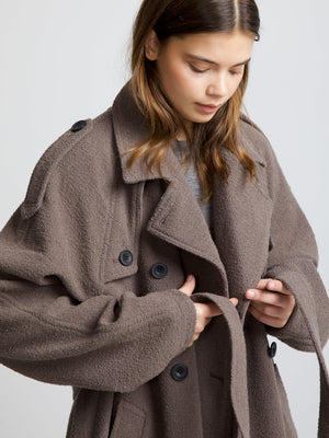 Cozy brown oversized coat with large buttons, perfect for layering, featuring a relaxed fit and soft texture by MEOTINE.