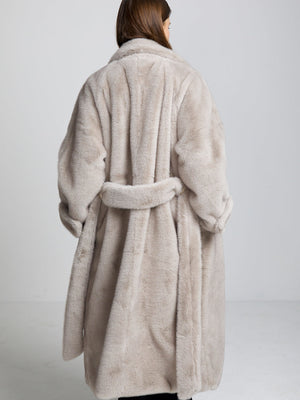 Cozy beige MEOTINE faux fur coat with a belted waist, featuring a plush texture and oversized fit, perfect for chilly days.