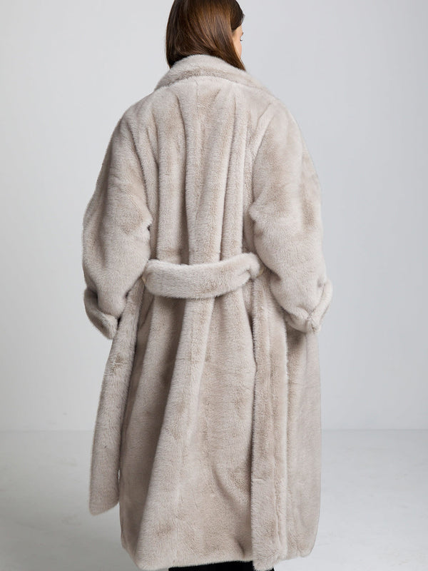 Cozy beige MEOTINE faux fur coat with a belted waist, featuring a plush texture and oversized fit, perfect for chilly days.