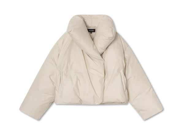 Stylish cream puffer jacket with a unique collar design, perfect for winter layering. Ideal for a chic, cozy look by MEOTINE.
