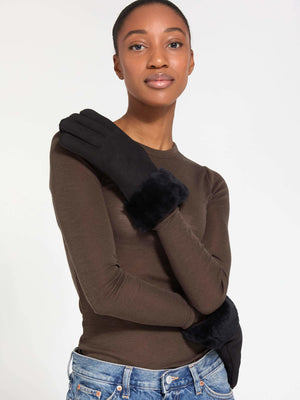 Stylish black gloves with a plush fur cuff, worn by a model in a fitted top, showcasing MEOTINE's elegant winter accessory.