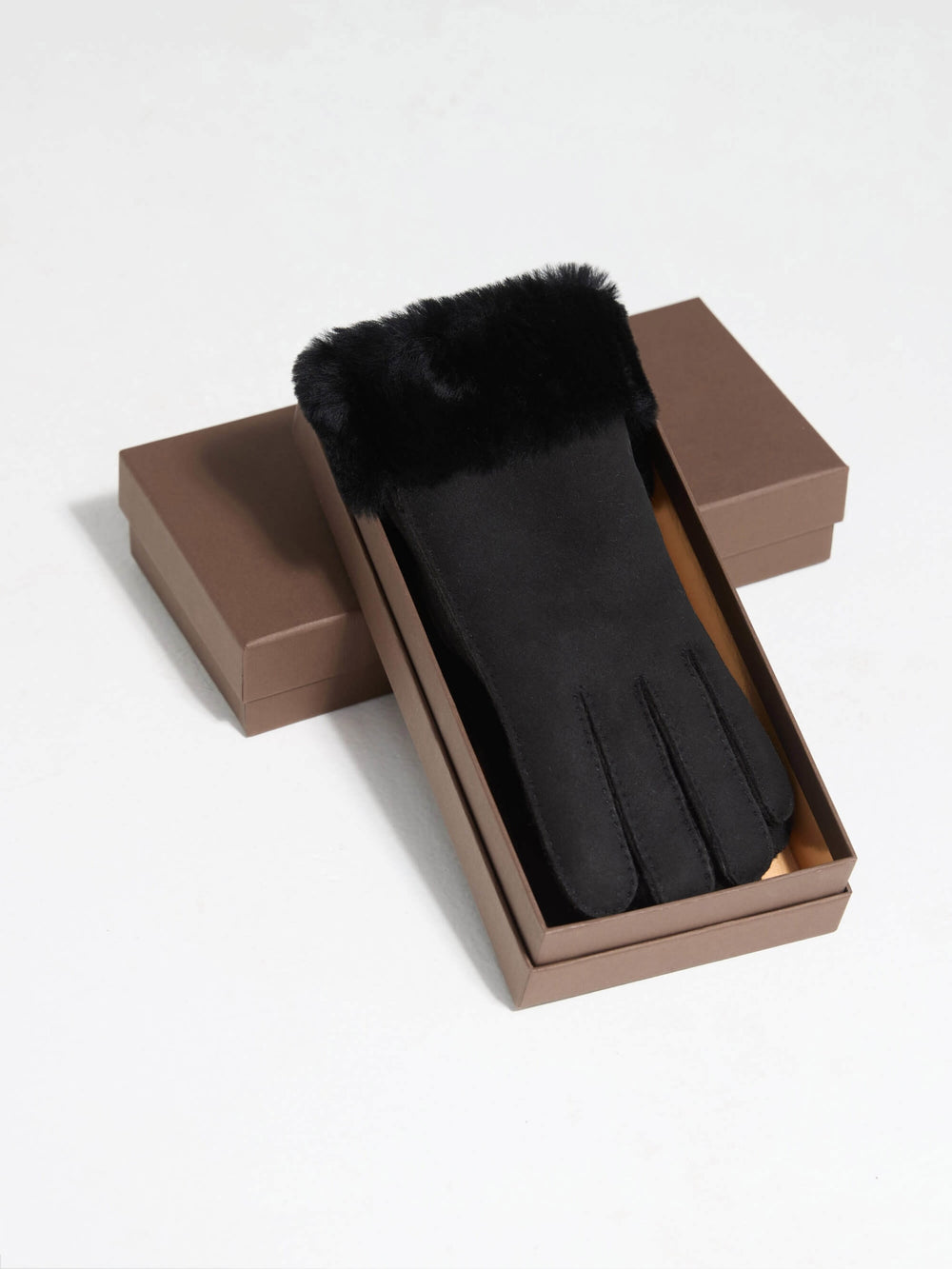 Stylish black gloves with a soft fur cuff, perfect for winter, featuring a sleek design by MEOTINE.