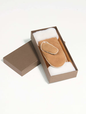Cozy MEOTINE hand warmer in a stylish box, featuring a soft suede exterior and plush interior for warmth and comfort.