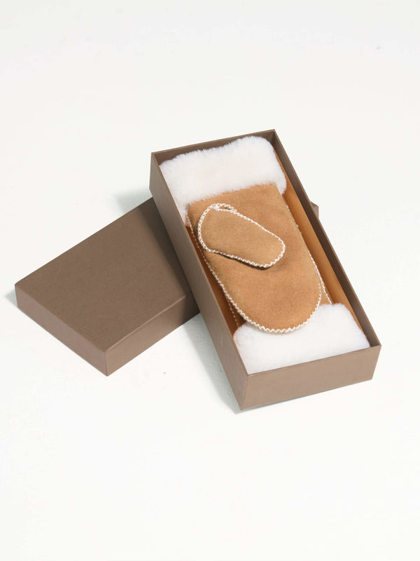 Cozy MEOTINE hand warmer in a stylish box, featuring a soft suede exterior and plush interior for warmth and comfort.