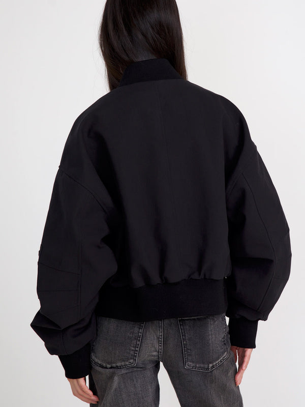 Stylish black cropped jacket with voluminous sleeves, perfect for a trendy look. Designed by MEOTINE for a modern aesthetic.