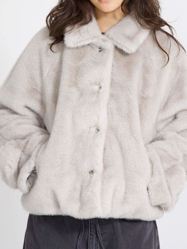 Cozy and stylish, this MEOTINE faux fur jacket features a button-up front and a soft, plush texture, perfect for chilly days.