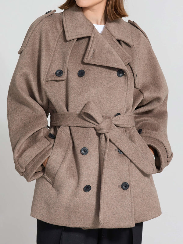 Stylish brown double-breasted coat with a belt, featuring large buttons and a relaxed fit, perfect for a chic look by MEOTINE.