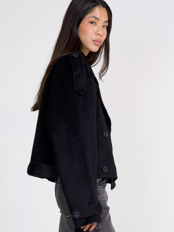 Stylish black cropped jacket with button details, perfect for a chic look. Designed by MEOTINE for a modern wardrobe.