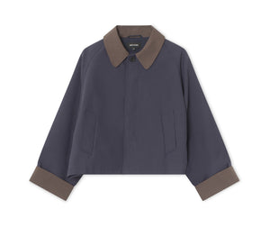 Stylish cropped jacket in navy with a contrasting brown collar and cuffs, perfect for a modern look. By MEOTINE.