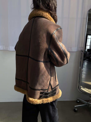 Stylish brown jacket with a cozy fur collar, featuring a unique design and a relaxed fit, perfect for a chic look by MEOTINE.