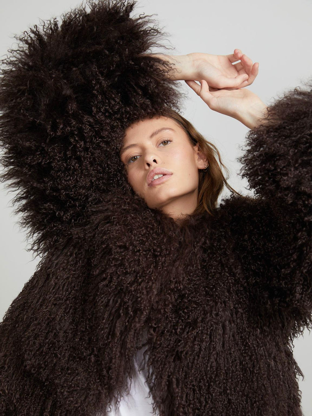 Cozy brown fluffy sweater with a relaxed fit, perfect for layering. Ideal for a stylish and warm look by MEOTINE.