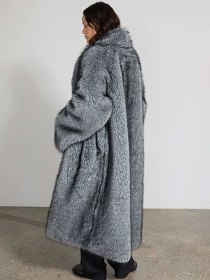 A model wearing a luxurious gray faux fur coat from MEOTINE, showcasing a cozy and stylish design from the back.