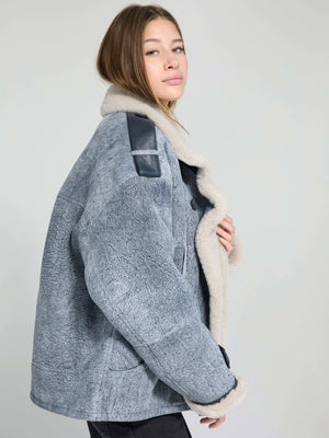 Stylish gray shearling jacket with a cozy fur collar, featuring leather accents, perfect for a chic winter look by MEOTINE.
